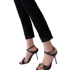 Pantaloni donna skinny con risvolto e strass